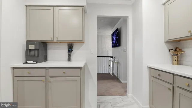 a kitchen with stainless steel appliances granite countertop a refrigerator stove and sink