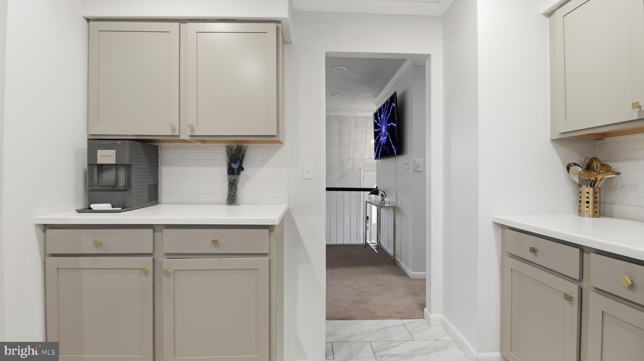 6710 Eilerson Street Clinton, MD 20735 - Photo 14 of 58 a view of cabinets with wooden floor