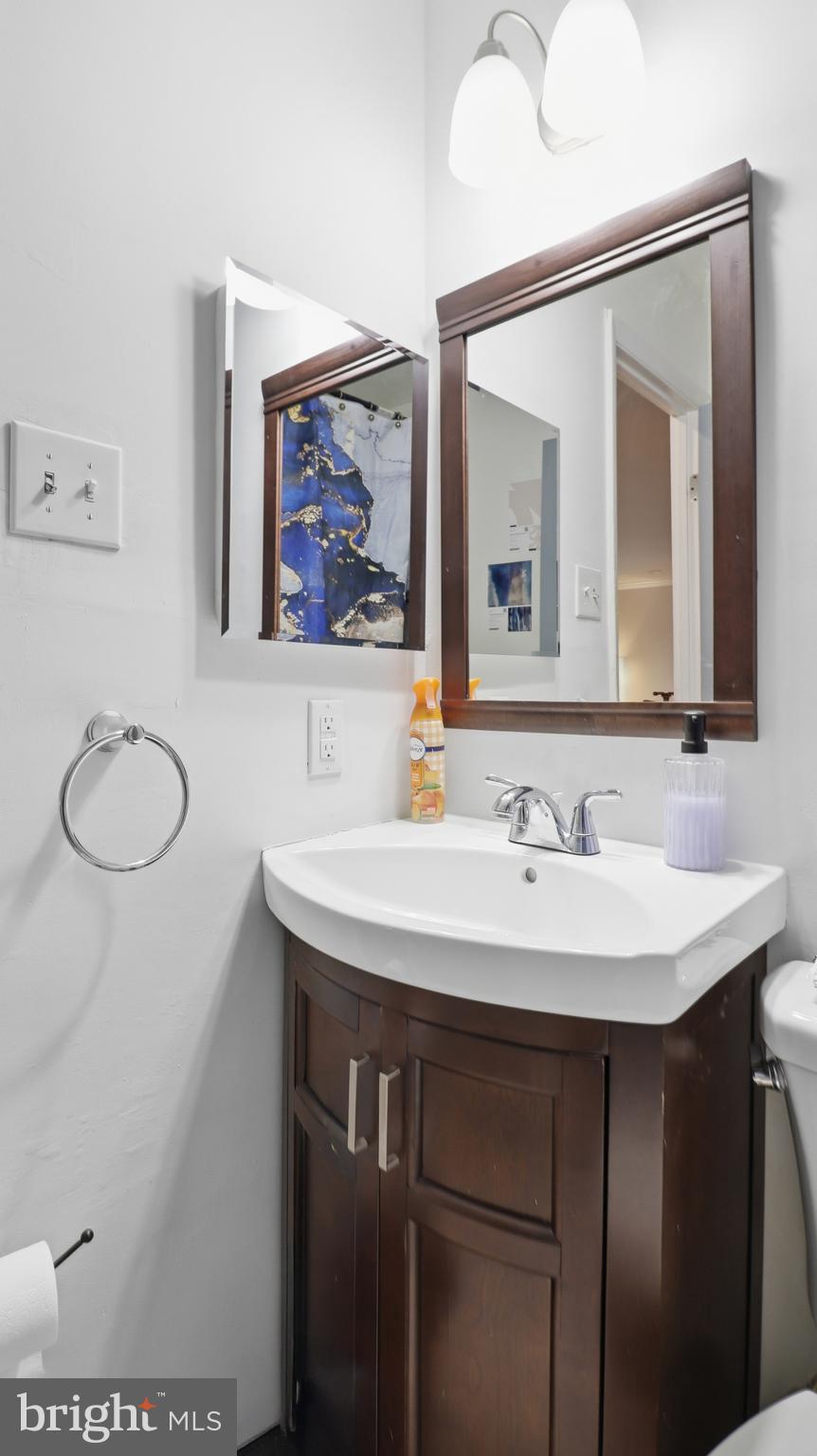 6710 Eilerson Street Clinton, MD 20735 - Photo 20 of 58 a bathroom with a sink and a mirror