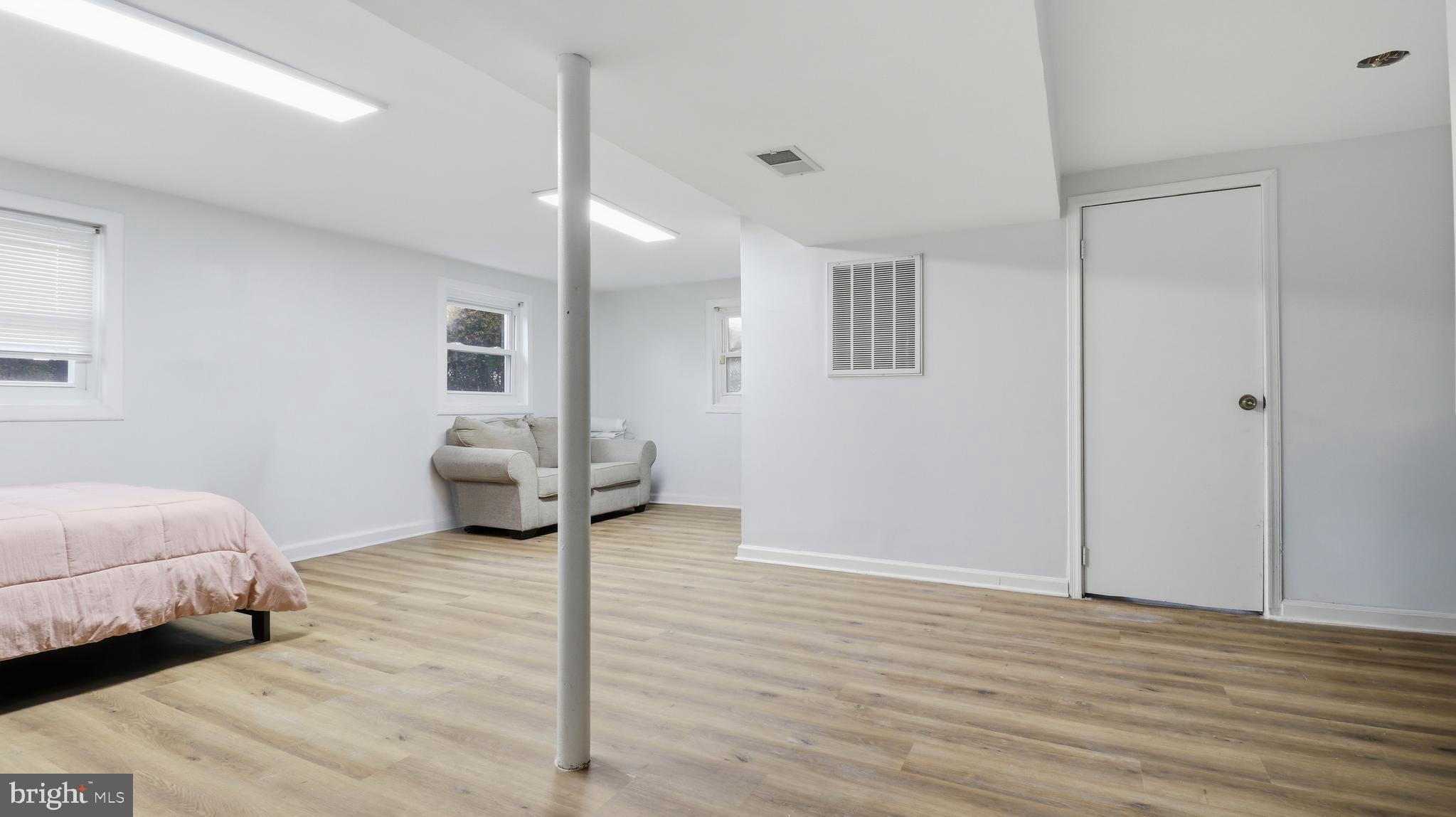 6710 Eilerson Street Clinton, MD 20735 - Photo 21 of 58 a spacious bedroom with a bed and a view of bathroom
