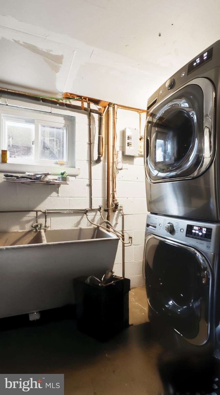6710 Eilerson Street Clinton, MD 20735 - Photo 34 of 58 a room with a sink and a washer dryer