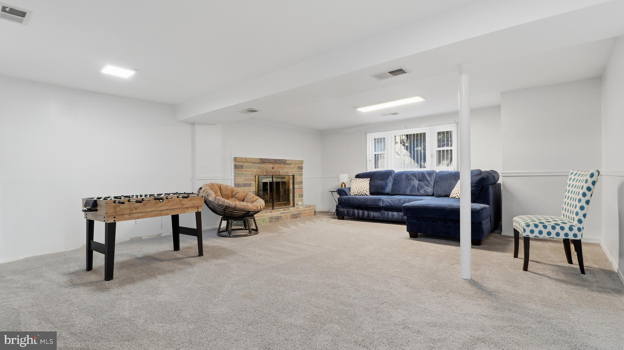 6710 Eilerson Street Clinton, MD 20735 - Photo 39 of 58 a living room with furniture and a fireplace