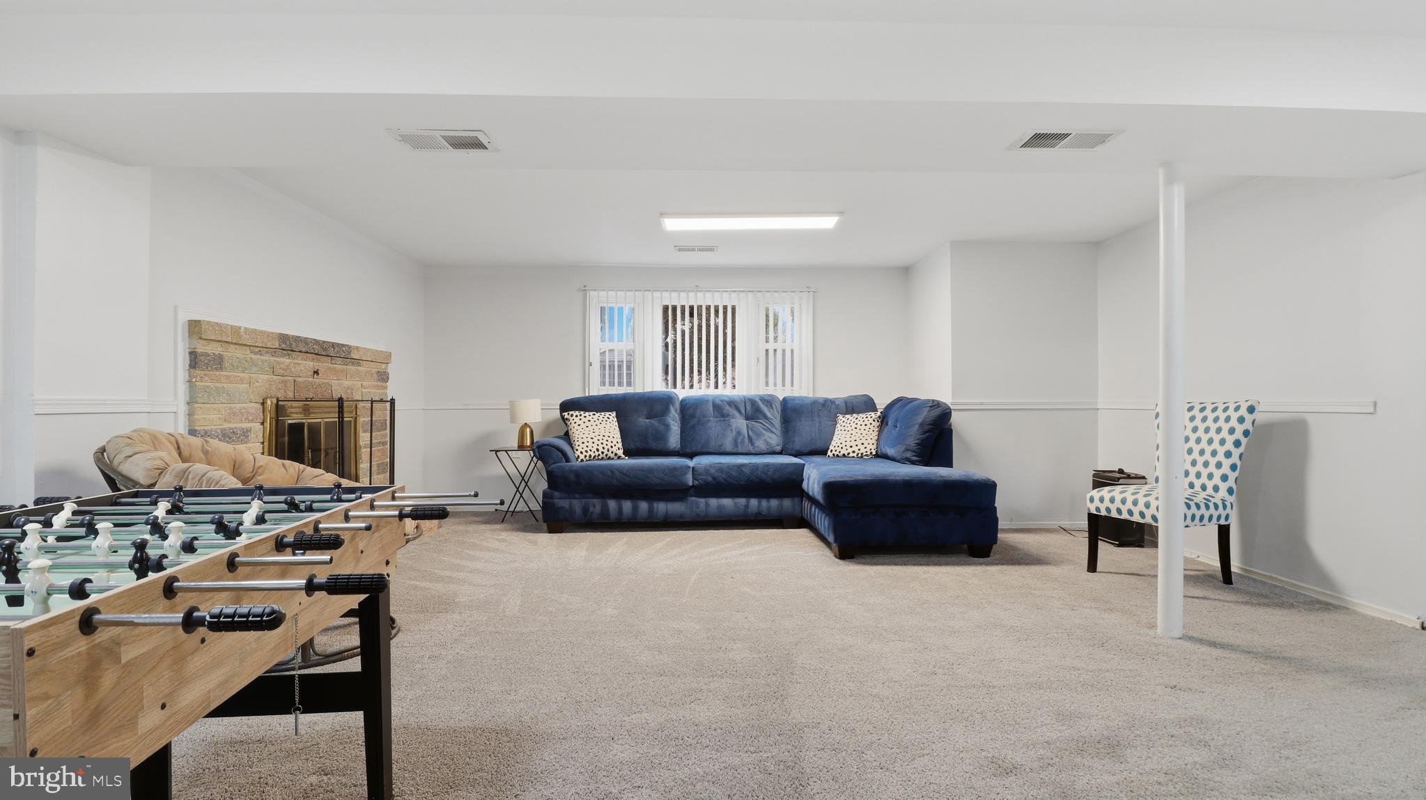 6710 Eilerson Street Clinton, MD 20735 - Photo 40 of 58 a living room with furniture and a fireplace