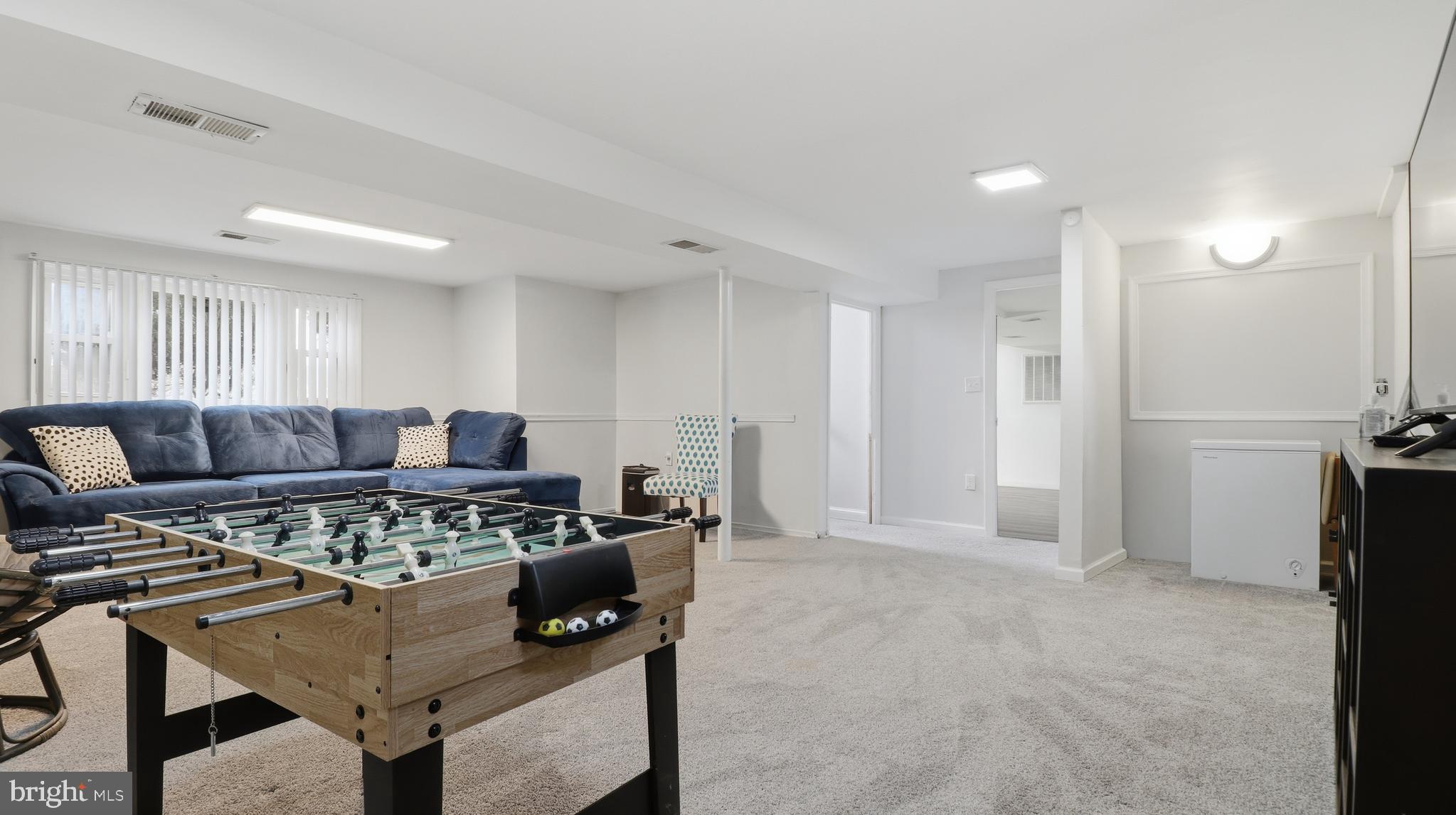 6710 Eilerson Street Clinton, MD 20735 - Photo 41 of 58 a living room with furniture and a rug