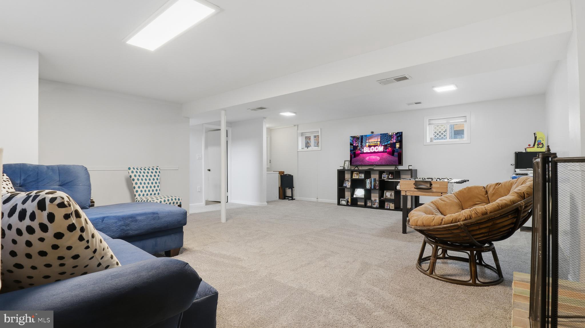 6710 Eilerson Street Clinton, MD 20735 - Photo 43 of 58 a living room with furniture and a flat screen tv