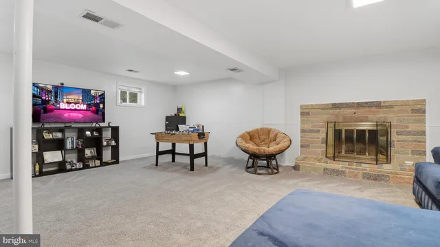 a living room with furniture and a stairs