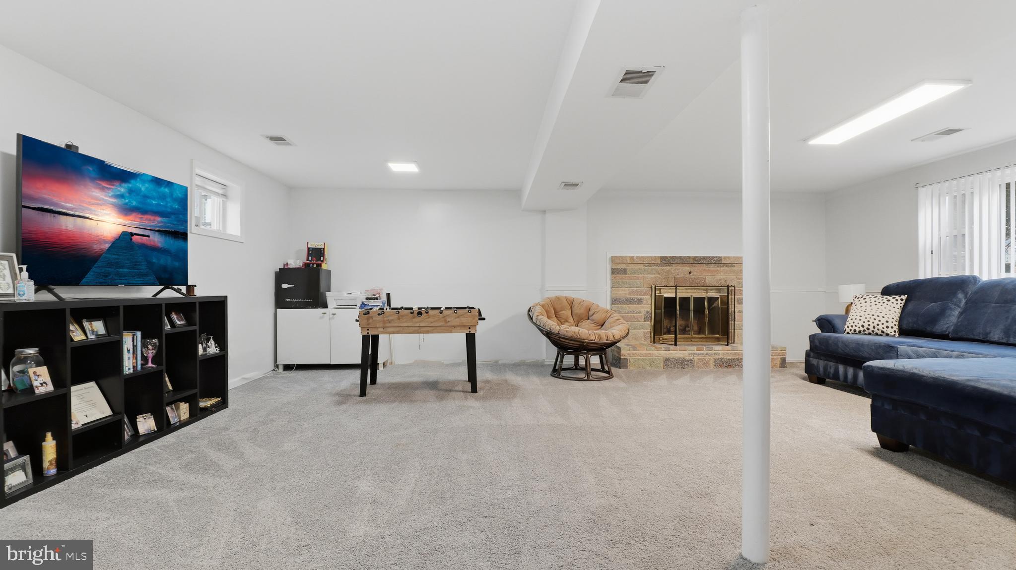 6710 Eilerson Street Clinton, MD 20735 - Photo 46 of 58 a living room with furniture and a flat screen tv