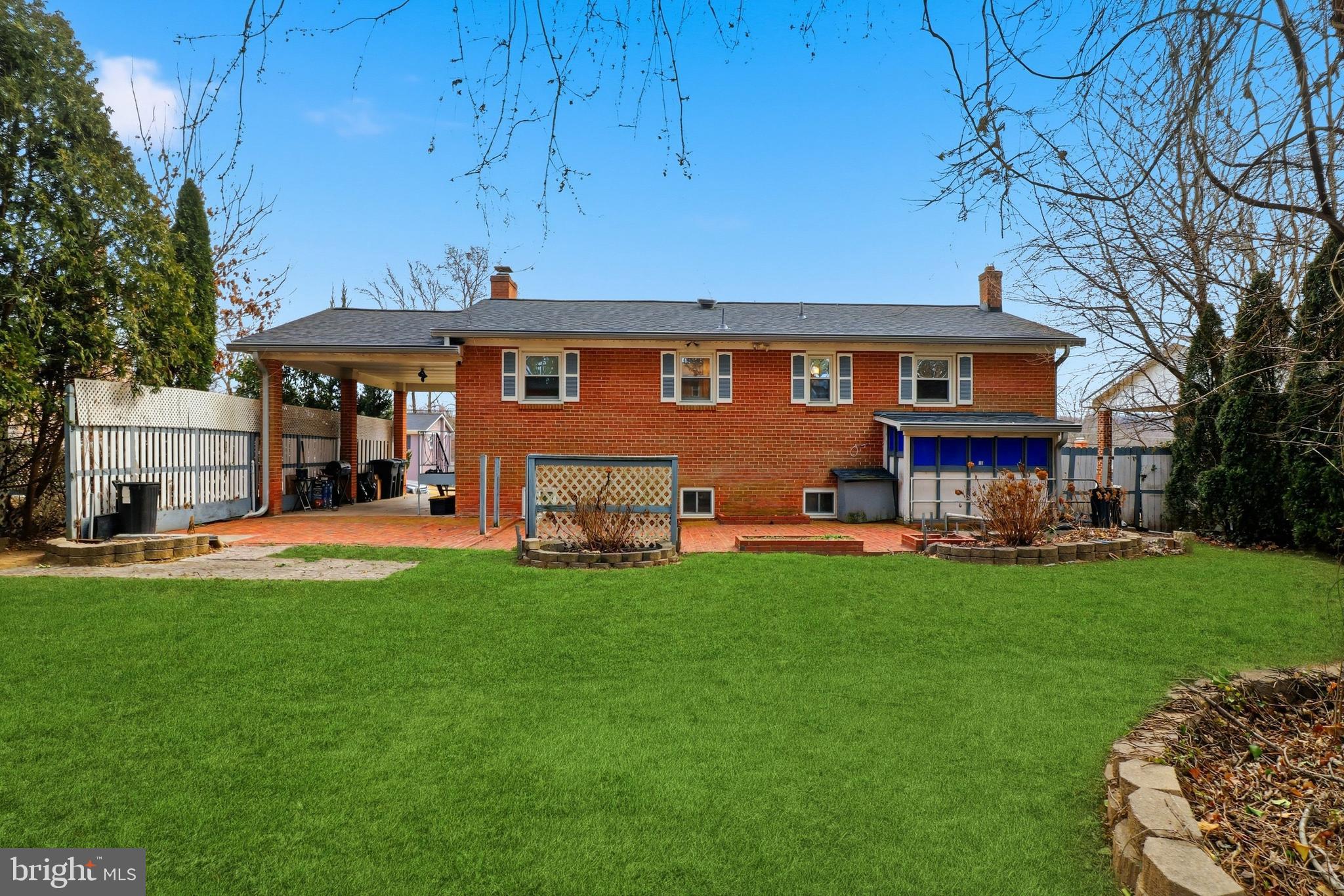 6710 Eilerson Street Clinton, MD 20735 - Photo 53 of 58 a front view of a house with a garden