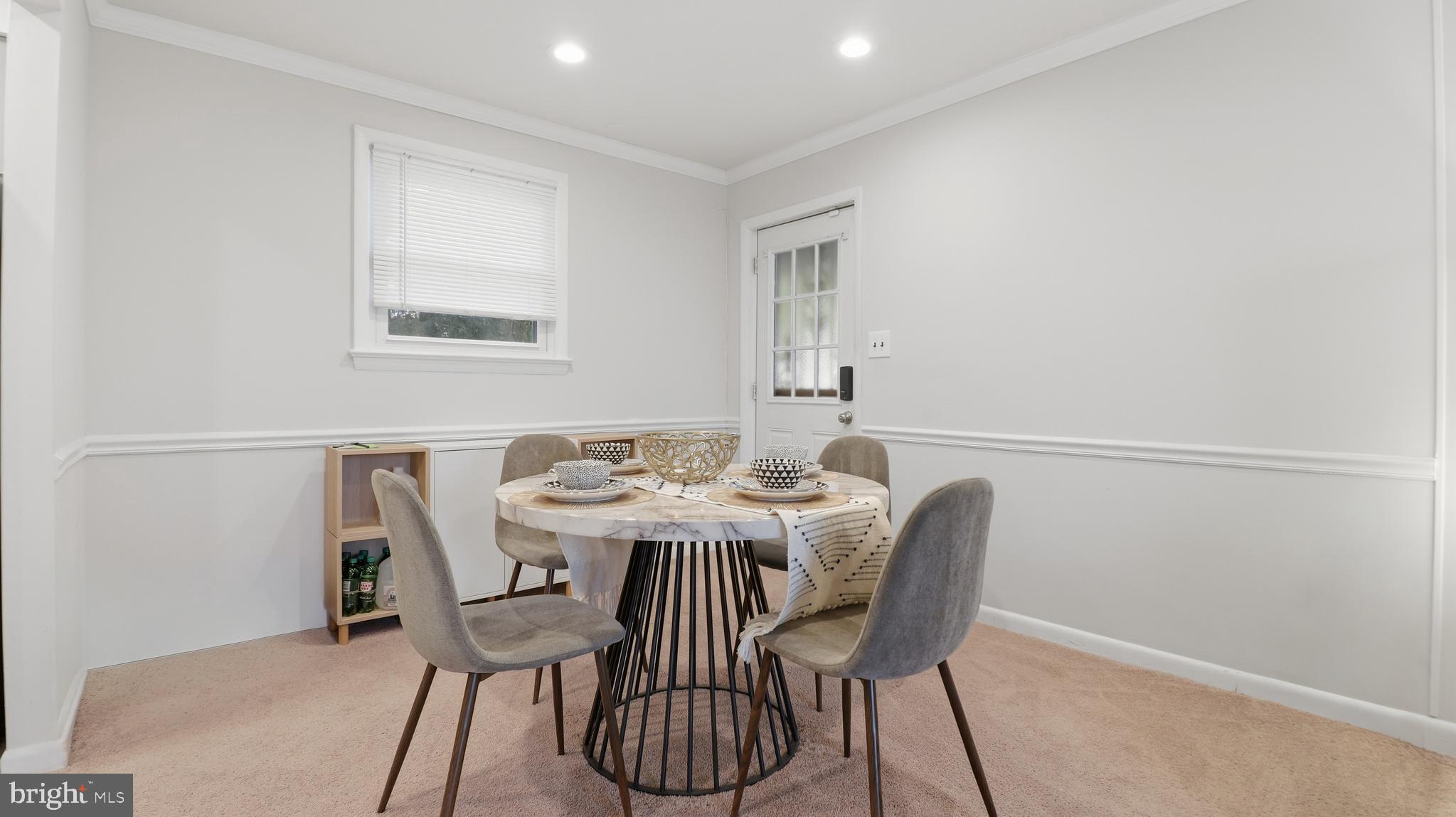 6710 Eilerson Street Clinton, MD 20735 - Photo 9 of 58 a view of a dining room with furniture and window