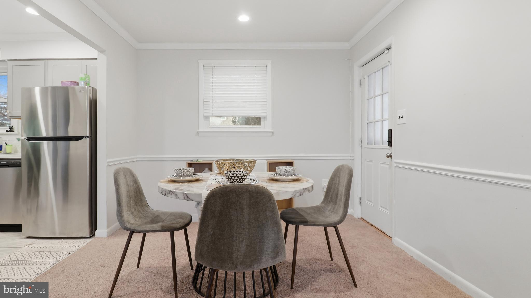 6710 Eilerson Street Clinton, MD 20735 - Photo 10 of 58 a view of a dining room with furniture and a window