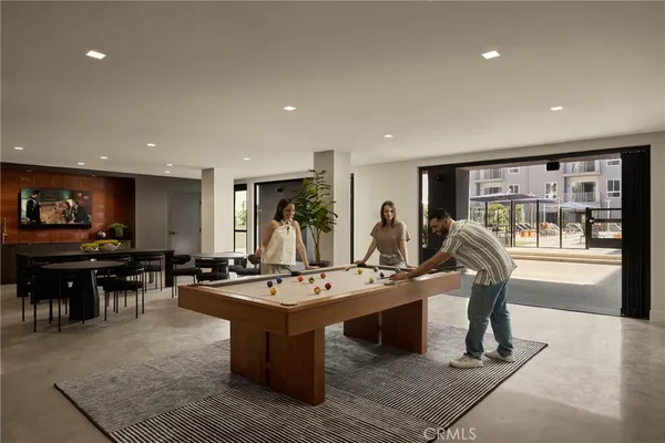 a kitchen with a dining table and chairs