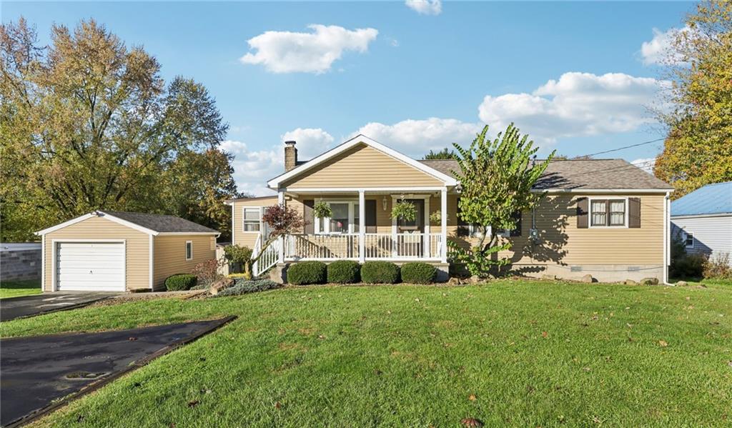 2422 Ridgewood Court New Castle, PA 16101 - Photo 1 of 50 a front view of a house with a yard and trees