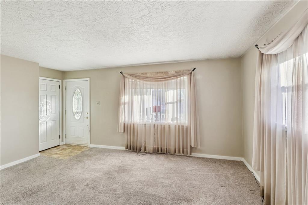 2422 Ridgewood Court New Castle, PA 16101 - Photo 17 of 50 an empty room with windows and closet