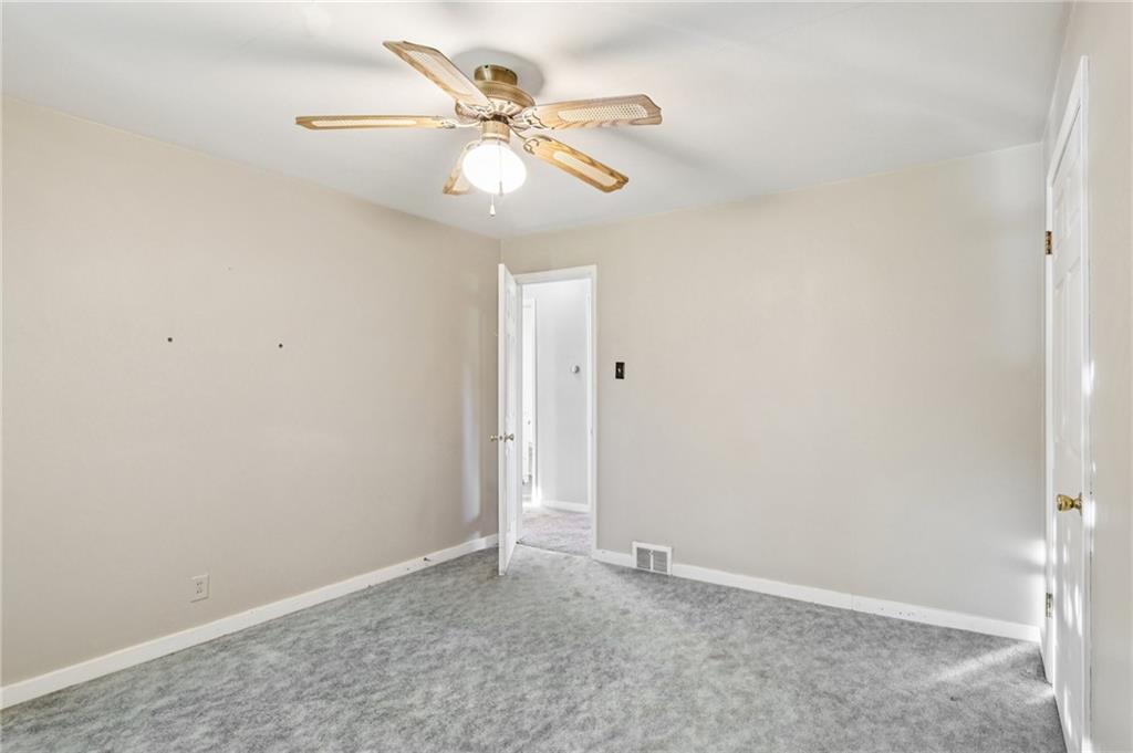 2422 Ridgewood Court New Castle, PA 16101 - Photo 25 of 50 an empty room with a fan and a fan