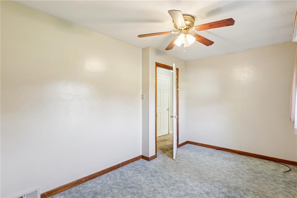 2422 Ridgewood Court New Castle, PA 16101 - Photo 29 of 50 an empty room with closet and a chandelier fan