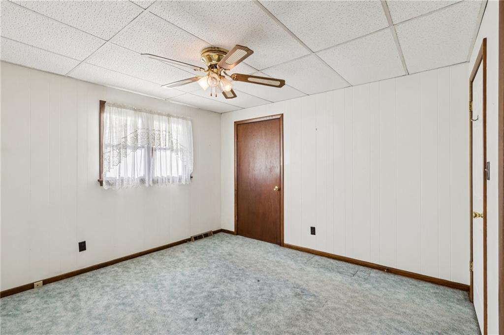2422 Ridgewood Court New Castle, PA 16101 - Photo 33 of 50 an empty room with windows and fan
