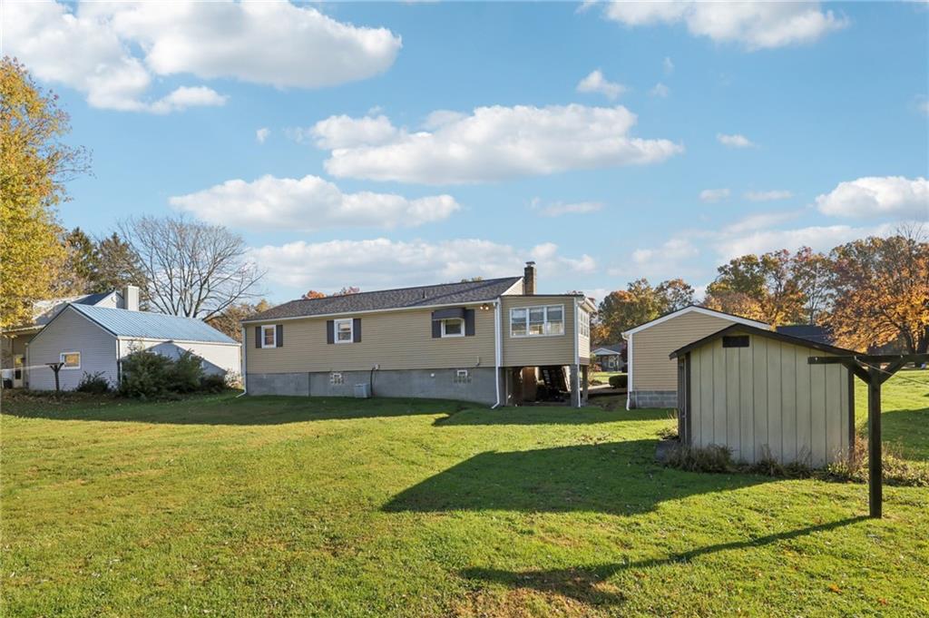 2422 Ridgewood Court New Castle, PA 16101 - Photo 49 of 50 a view of a house with a big yard and large tree