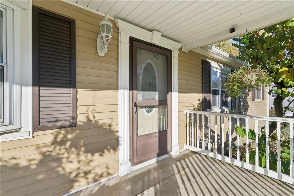 2422 Ridgewood Court New Castle, PA 16101 - Photo 6 of 50 a view of a porch with a table and chairs and wooden fence