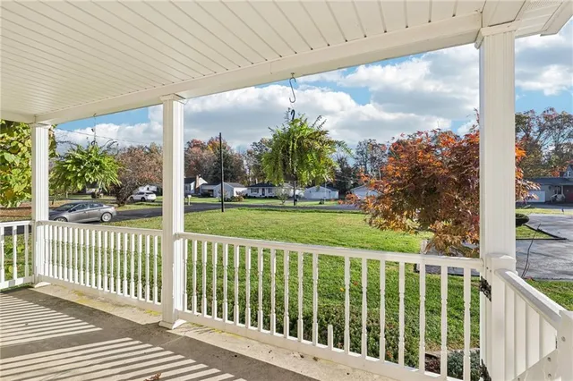 a view of a porch with a big yard