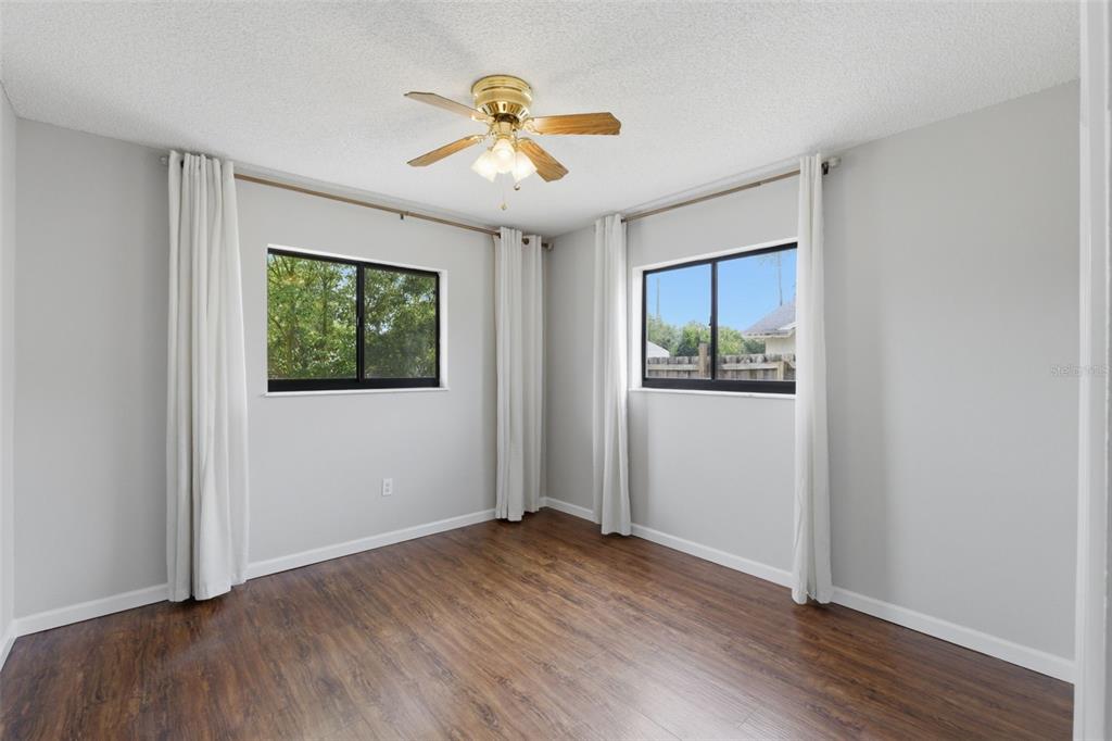 4966 Keysville Avenue Spring Hill, FL 34608 - Photo 37 of 48 a view of empty room with wooden floor