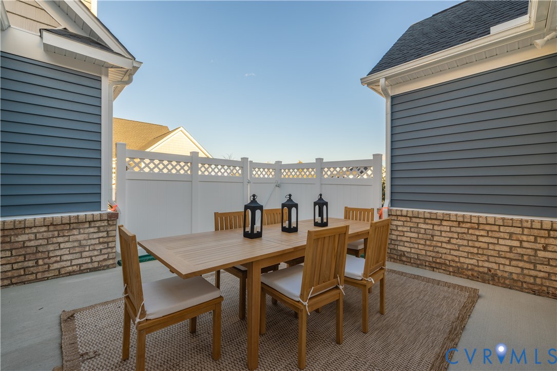 6609 Mayland Rdg Lane; Moseley, VA 23120 - Photo 16 of 20 a view of a roof deck with table and chairs