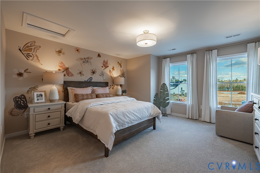 6609 Mayland Rdg Lane; Moseley, VA 23120 - Photo 19 of 20 a spacious bedroom with a bed and a large window