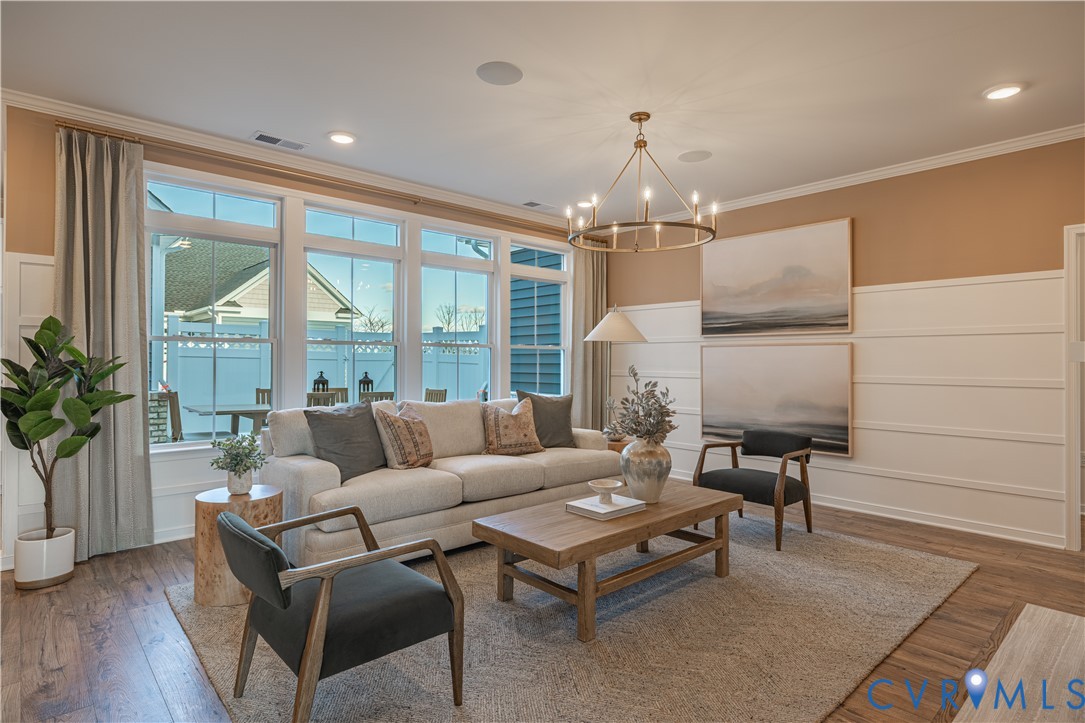 6609 Mayland Rdg Lane; Moseley, VA 23120 - Photo 4 of 20 a living room with furniture and a chandelier