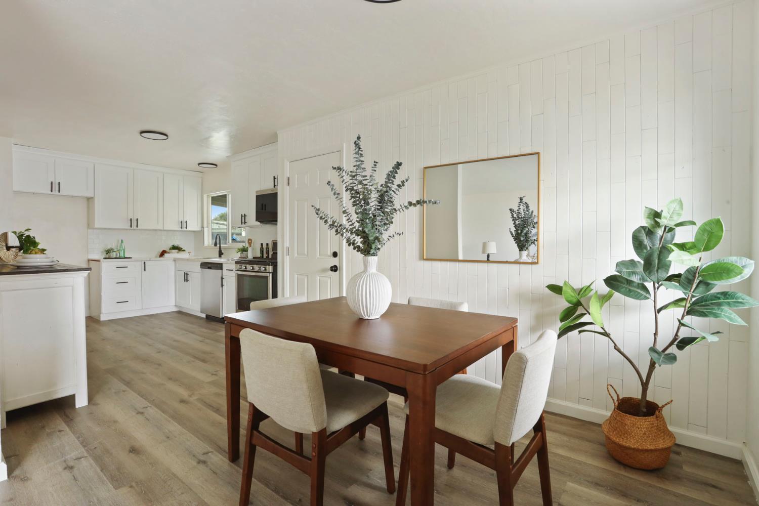 1636 South School Street Lodi, CA 95240 - Photo 13 of 33 a view of a dining room with furniture and wooden floor