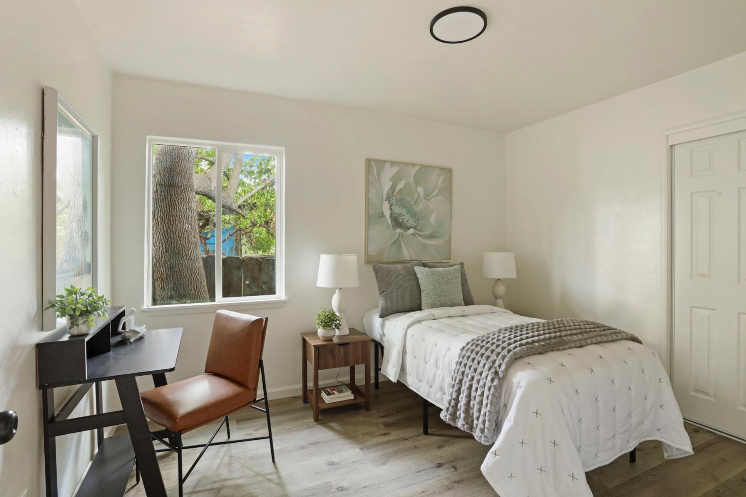 1636 South School Street Lodi, CA 95240 - Photo 22 of 33 a bedroom with a bed and a window