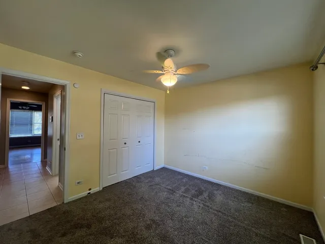 an empty room with a view of a bathroom