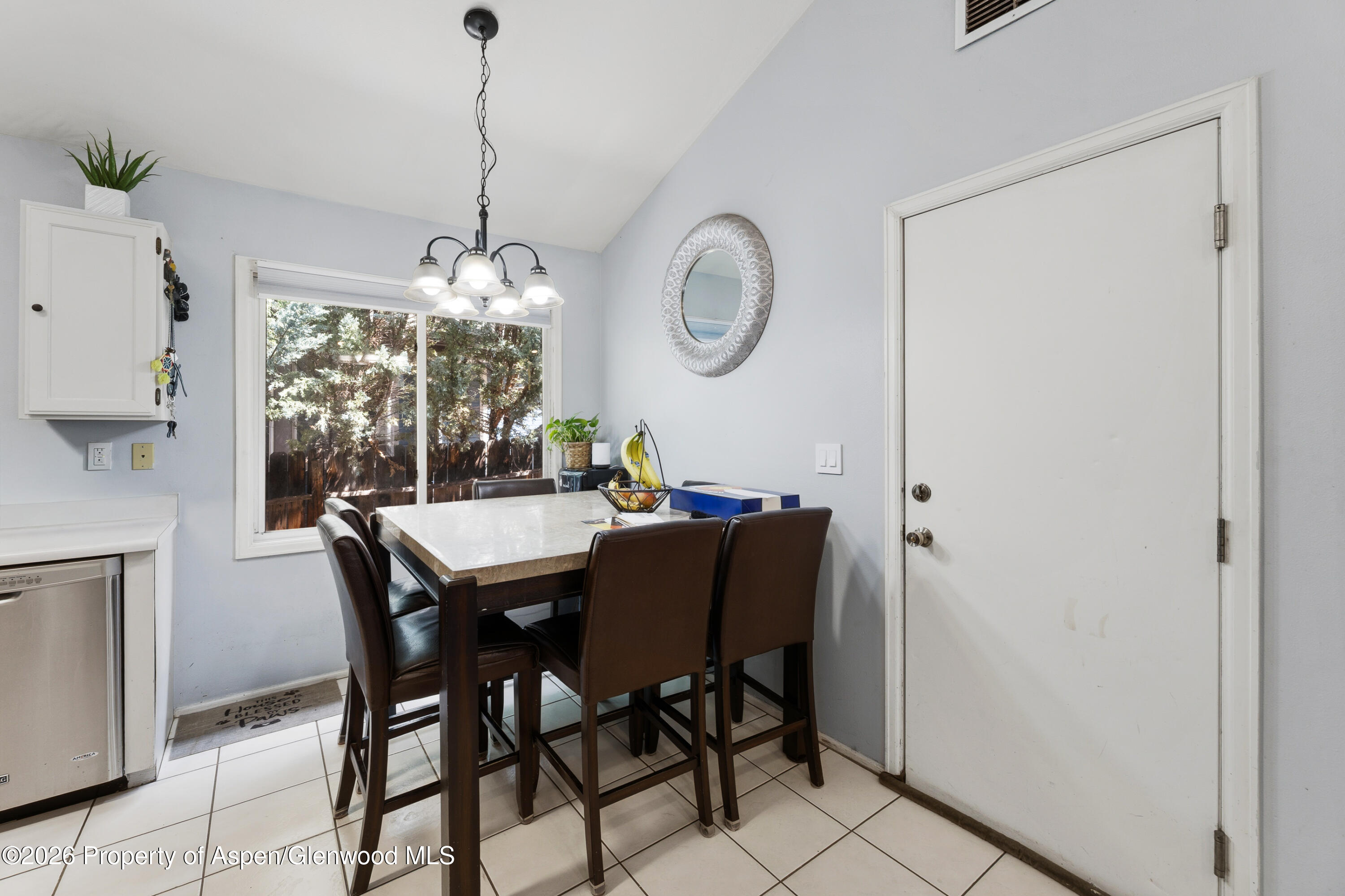 164 Current Drive New Castle, CO 81647 - Photo 12 of 34 a dining room with furniture a chandelier and window