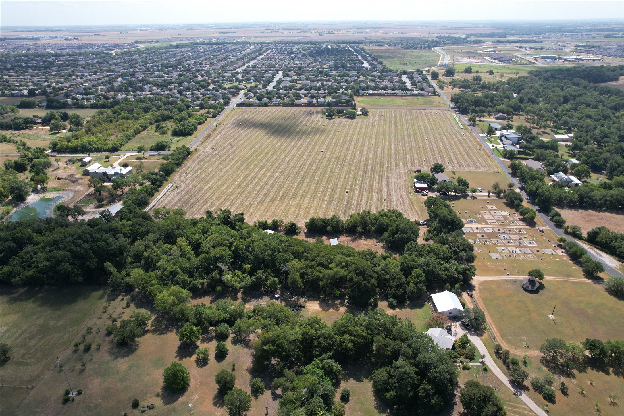 135 Rd Hutto Tx 78634 Road Hutto, TX 78634 - Photo 8 of 10 Expansive pastures and mature trees characterize this vast rural landscape.