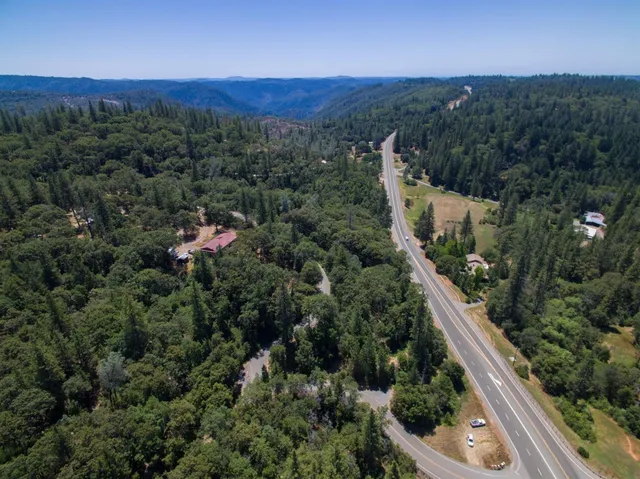 an aerial view of a house with mountain view