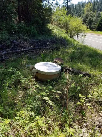a backyard of a house with a yard and outdoor seating