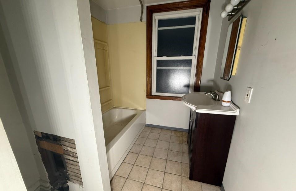 2831 Custer Avenue Pittsburgh, PA 15227 - Photo 12 of 28 a bathroom with a sink and a mirror