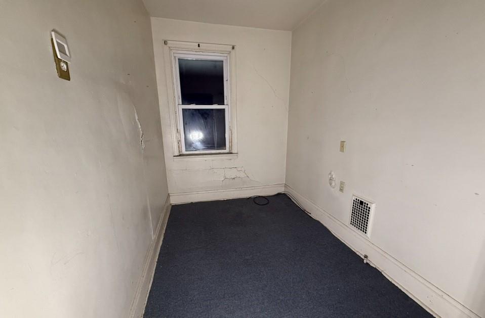 2831 Custer Avenue Pittsburgh, PA 15227 - Photo 20 of 28 a view of an empty room with a kitchen and closet