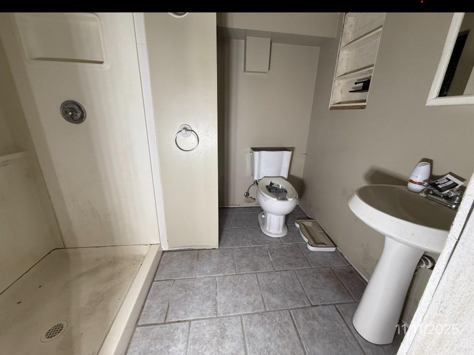 2831 Custer Avenue Pittsburgh, PA 15227 - Photo 21 of 28 a bathroom with a sink and a toilet