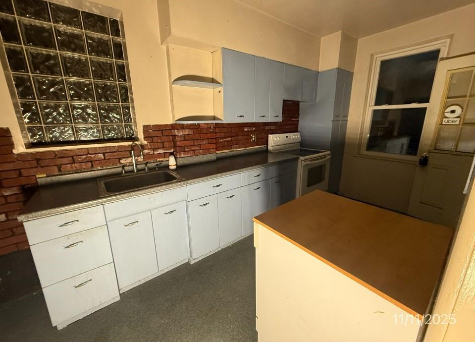 2831 Custer Avenue Pittsburgh, PA 15227 - Photo 10 of 28 a kitchen with a refrigerator and a sink