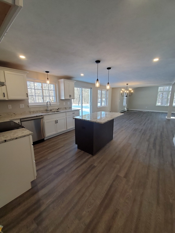 205 Whitney Road Phillipston, MA 01331 - Photo 3 of 8 a large kitchen with cabinets a sink and dishwasher a stove with wooden floor
