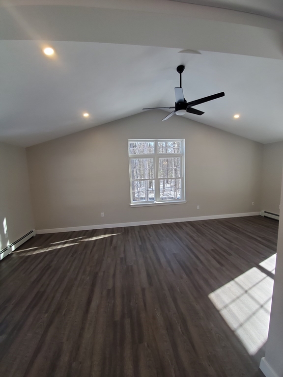 205 Whitney Road Phillipston, MA 01331 - Photo 4 of 8 an empty room with wooden floor chandelier and windows