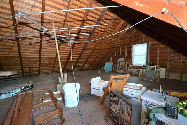 a patio outdoor space with patio furniture and potted plants