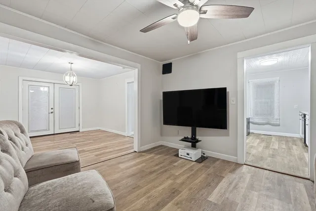 a view of a livingroom with workspace and a window