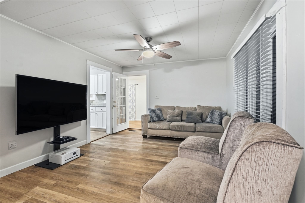 18 Charpentier Boulevard Chicopee, MA 01013 - Photo 10 of 37 a living room with furniture and a flat screen tv