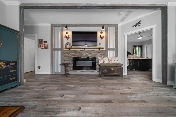 a living room with a flat screen tv and a fireplace