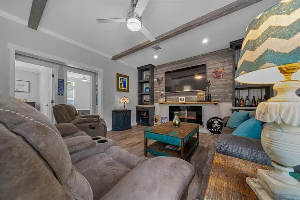 a living room with furniture and a flat screen tv