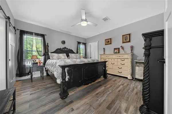 a bedroom with a bed and a dresser