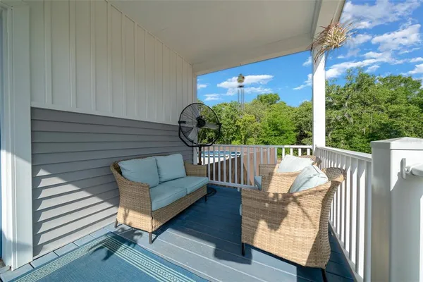 a view of a balcony with furniture