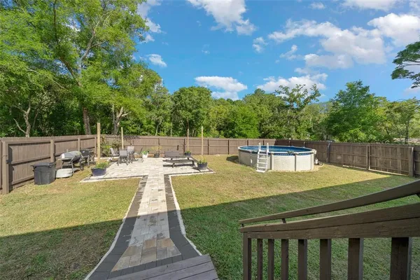 a view of a patio with swimming pool