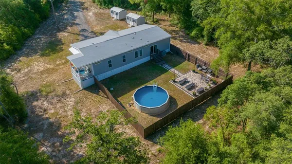aerial view of a backyard with chairs