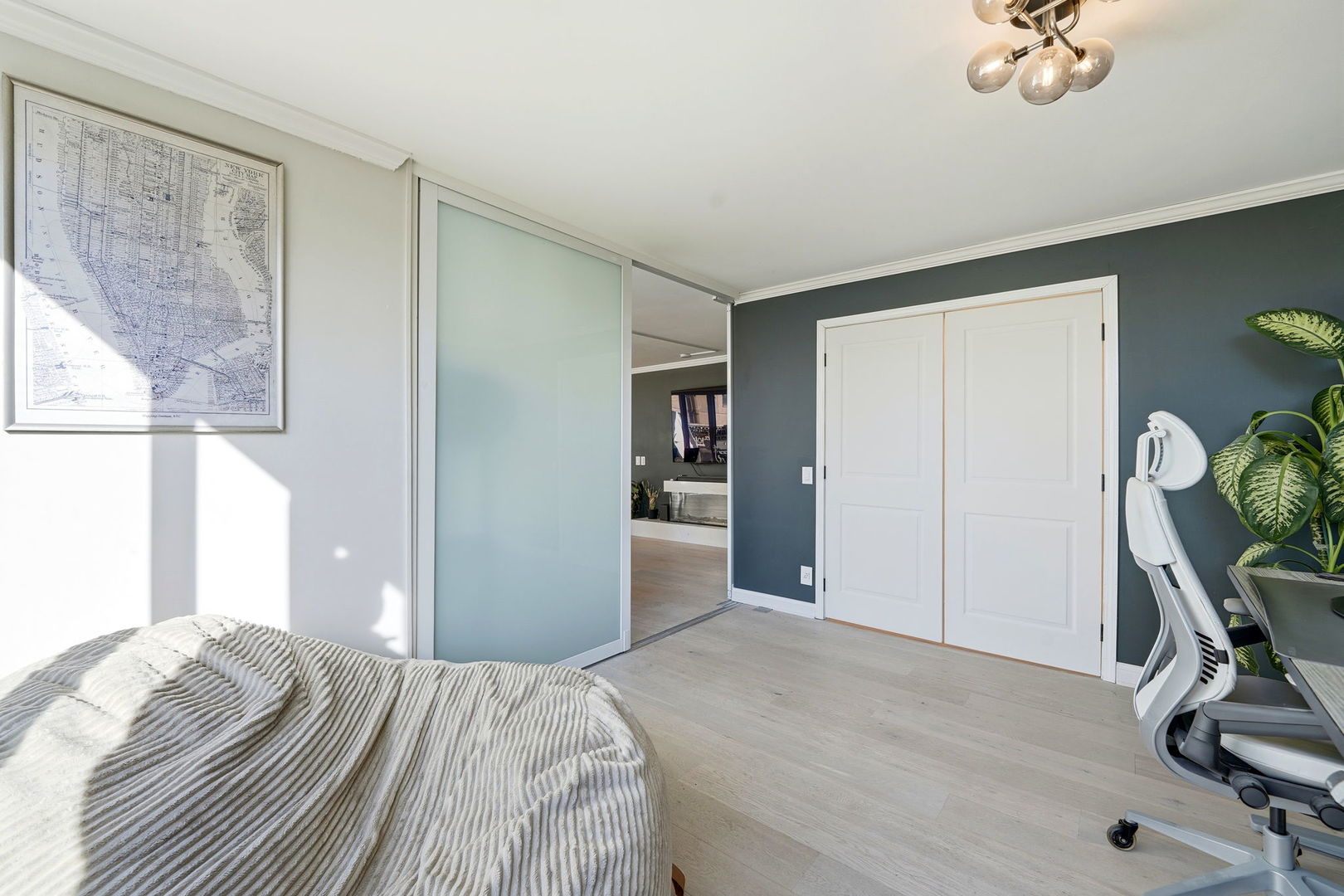 1516 North State Parkway, Unit 5D Chicago, IL 60610 - Photo 13 of 33 a bedroom with a bed and a chandelier